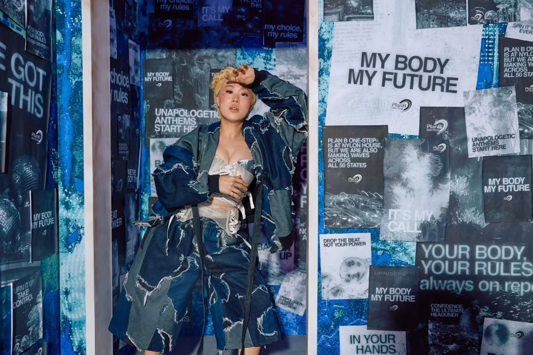 Female modeling streetwear.