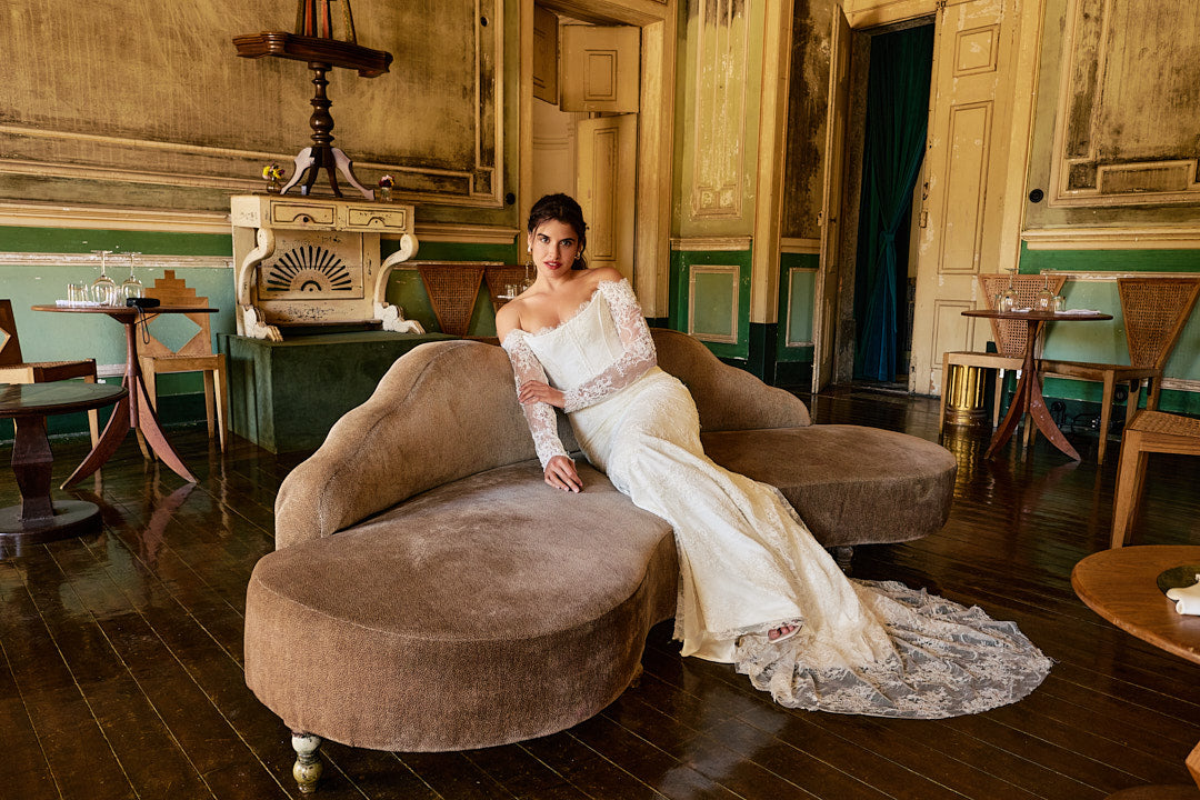 Woman is modeling a bridal gown.