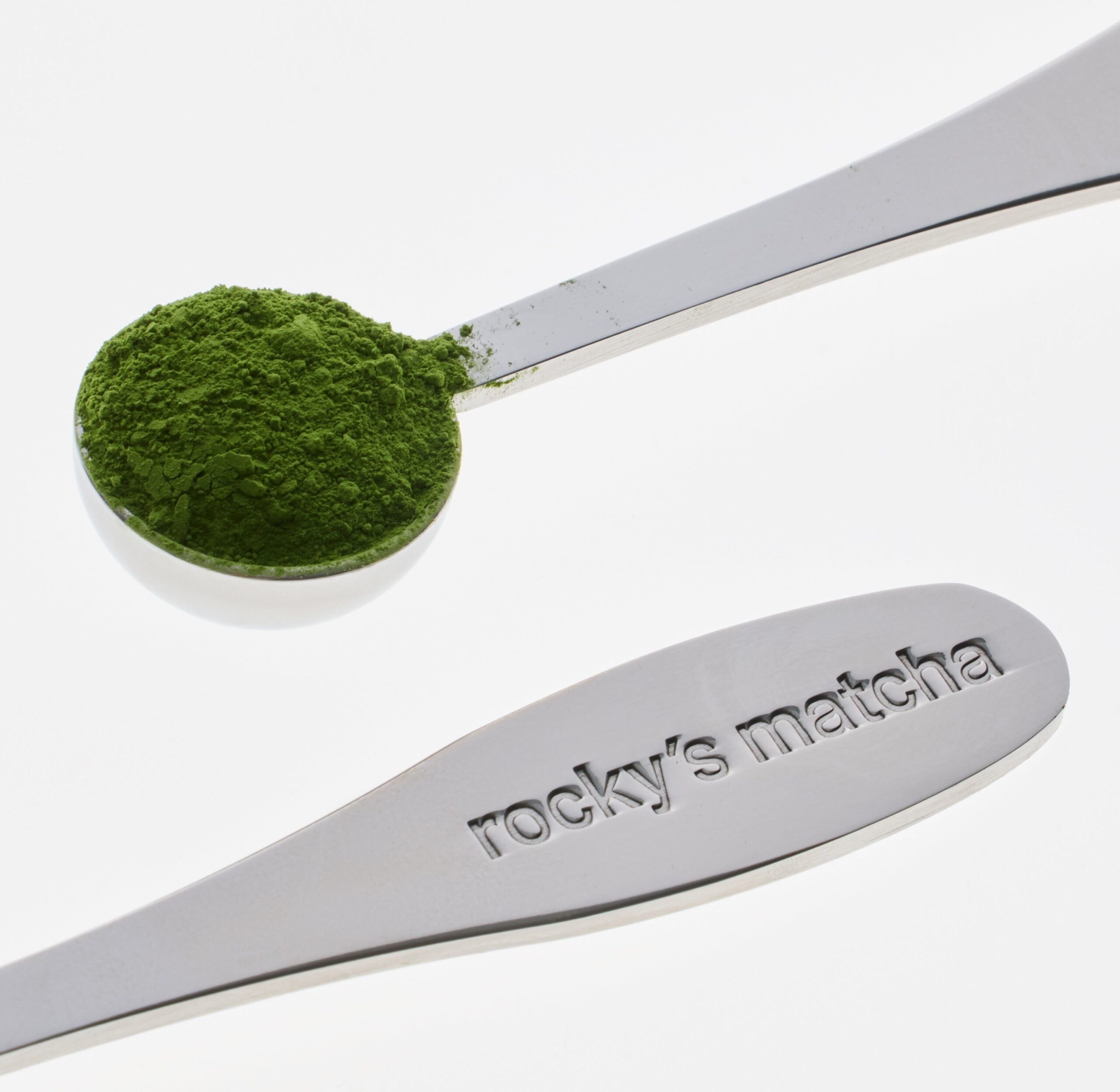 Rocky’s Matcha powder sits in the Rocky’s Matcha measuring spoon.
