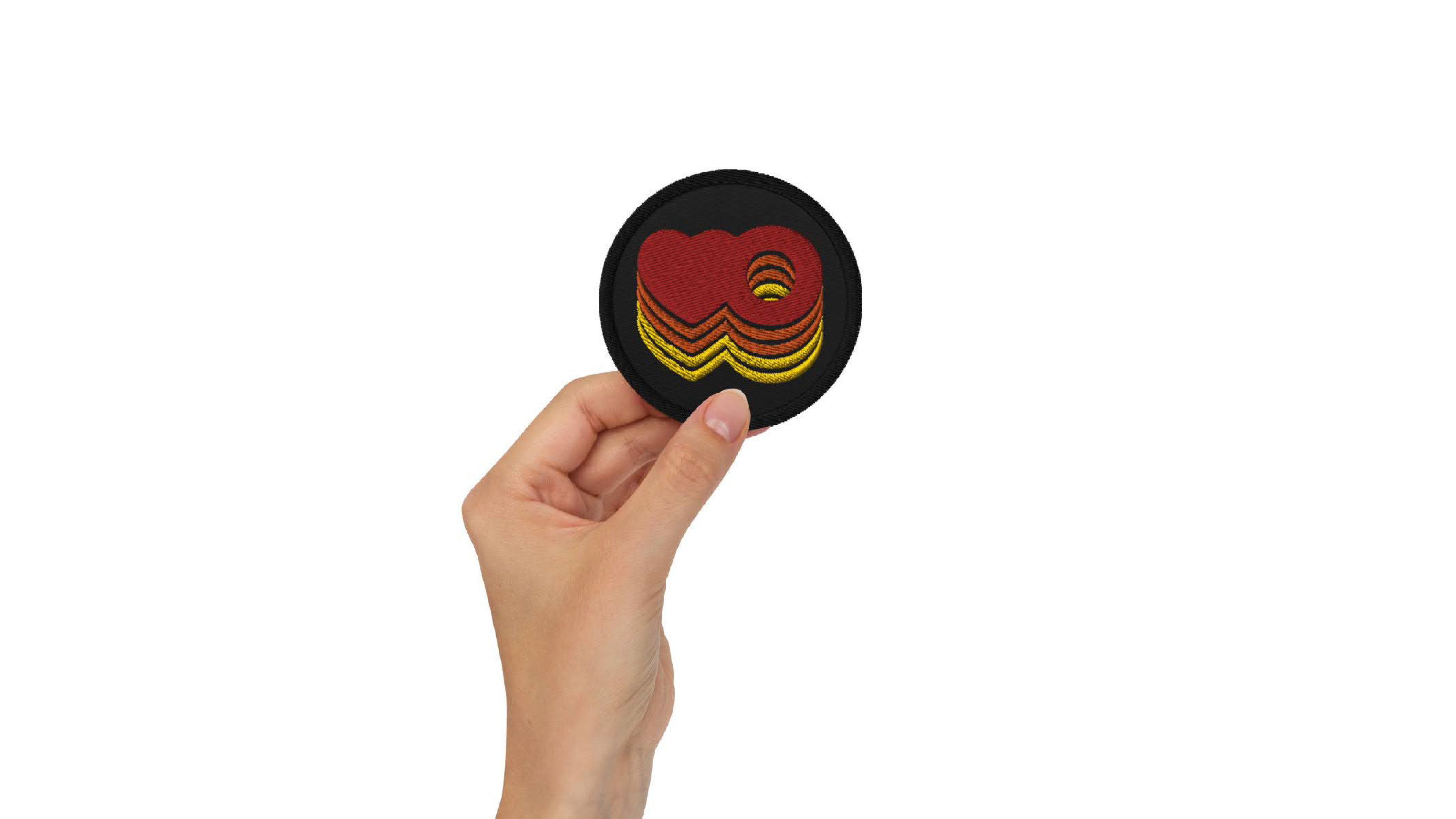 Embroidered patch featuring a heart and an O blending together