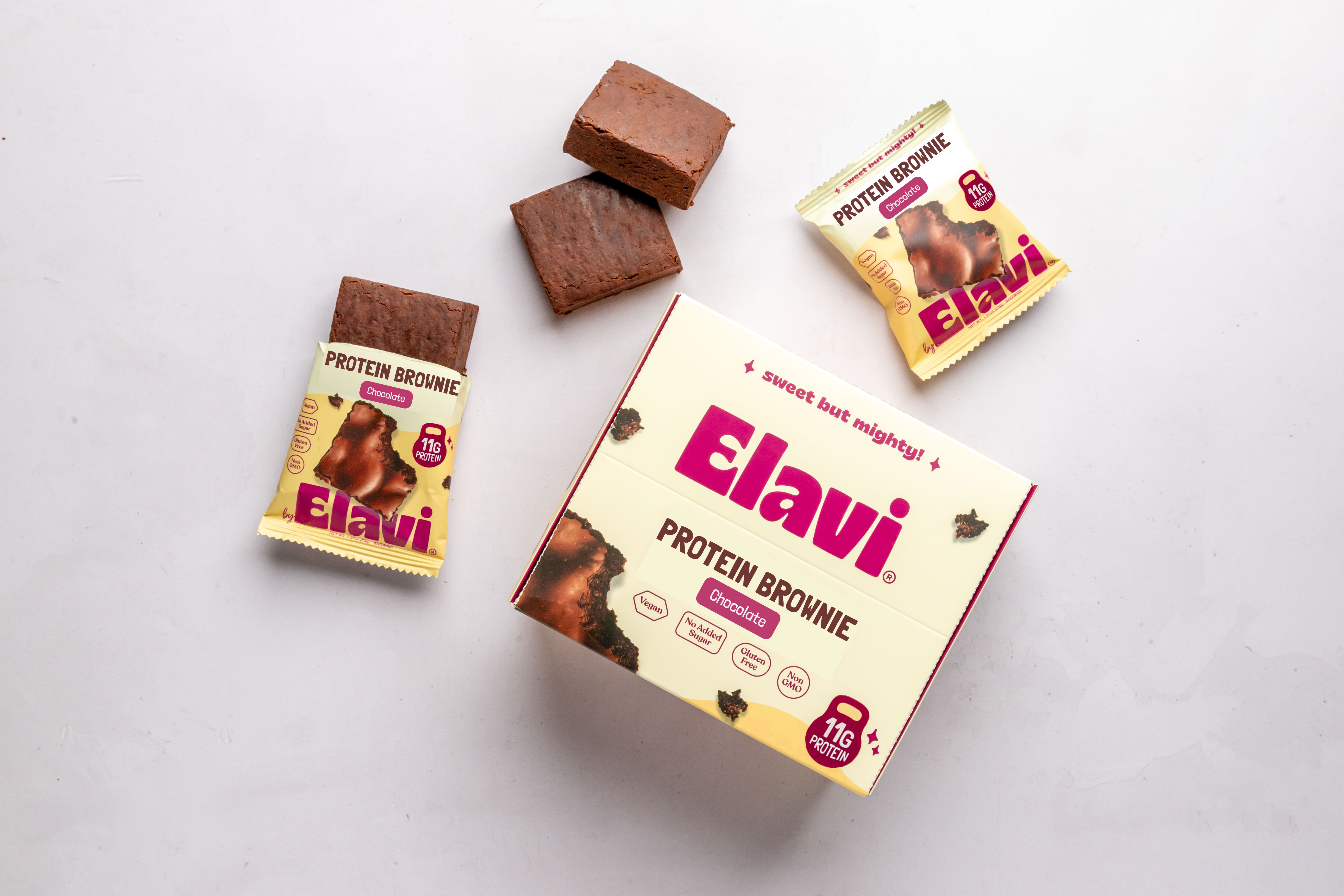 The Elavi protein brownie box, with a few brownies outside of the original packaging.